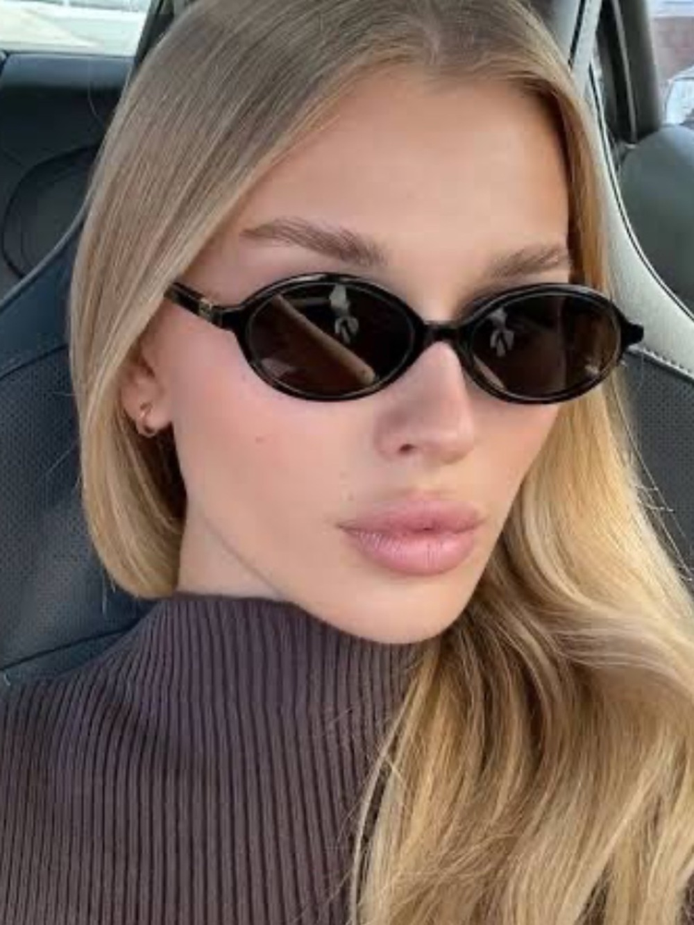 Miu Miu Regarde Black Oval Sunglasses with Gold Logo Accents
